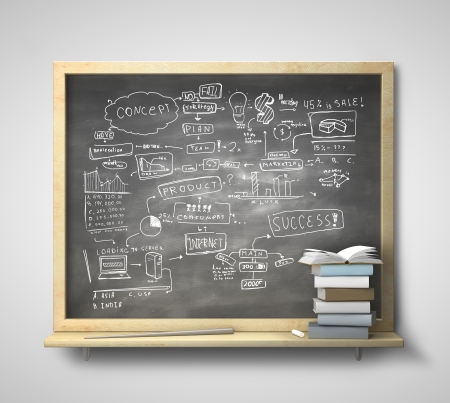 blackboard with business concept  and book on a gray wallの写真素材