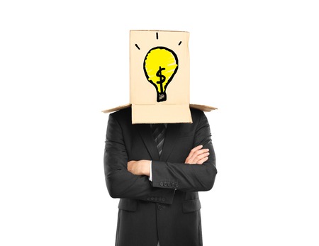 man and a box with bulb on headの写真素材