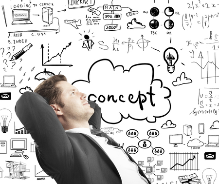 relaxed man sitting with drawing business conceptの写真素材