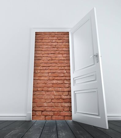 room with opened door to brick wallの写真素材