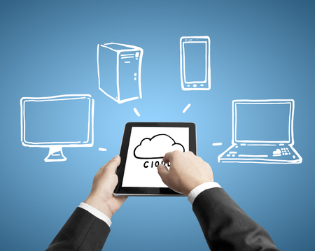 hands holding tablet with computer networkの写真素材