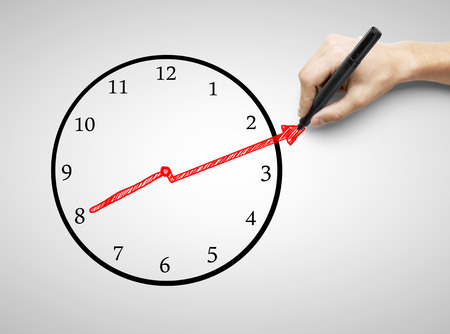 hand drawing clock on a gray backgroundの写真素材