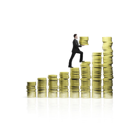 man climbing up  on chart of gold coinsの写真素材