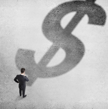 businessman looking to dollar symbolの写真素材