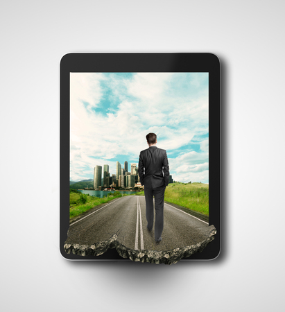 businessman walking on road  in tabletの写真素材