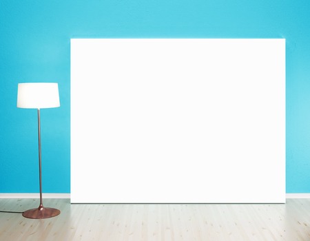 cardboard in blue room with ceiling lampの写真素材