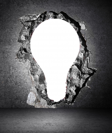 concrete wall with a hole in the bulb formの写真素材