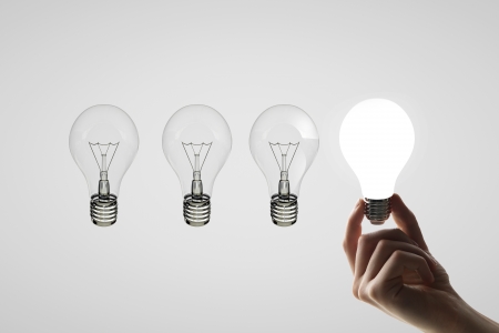 hand holding four lamps, idea conceptの写真素材