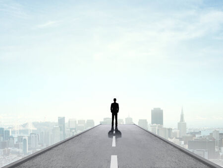 businessman standing and looking on cityの写真素材