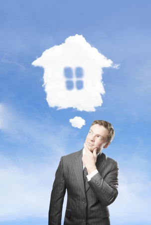 young businessman dreaming  of a new houseの写真素材