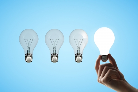 hand holding four lamps,  idea conceptの写真素材