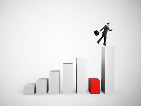 businessman jumping on big graph   on white backgroundの写真素材