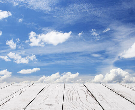 wood floor and blue sky with cloudsの写真素材