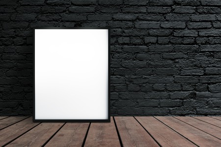 blank placard hanging on wallの写真素材