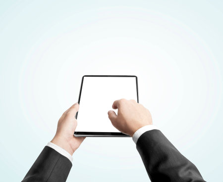 businessman holding digital tablet, closeupの写真素材