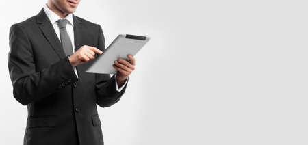 businessman holding digital tablet, close upの写真素材