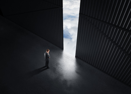 businessman thinking and open doors to skyの写真素材
