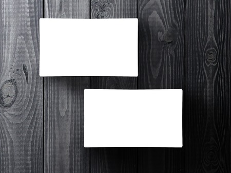 two business cards stack up on gray tableの写真素材