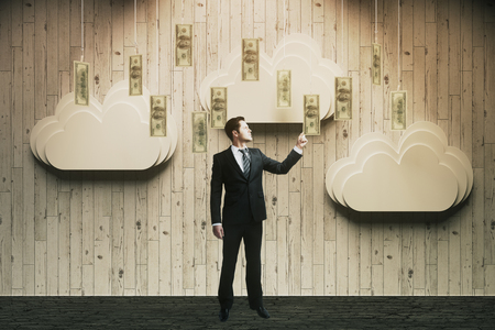 Wealth concept with abstract money rain and businessman touching banknotes. 3D Renderの写真素材
