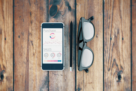 Phone with diagrams and sunglasses on wooden desktop. 3D Renderingの写真素材