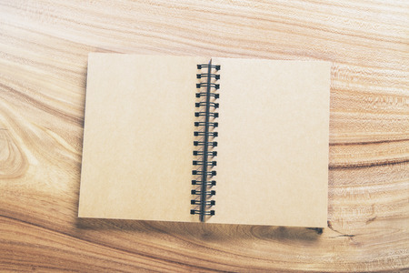 Topview of blank aged notepad on wooden table. Mock upの写真素材