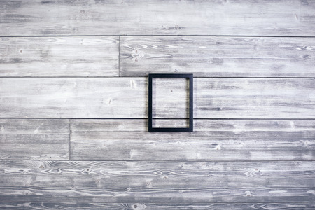 Black see-through frame on wooden background. Mock upの写真素材