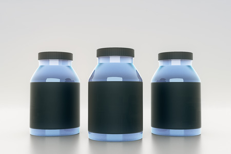 Blue glass bottles with empty black labels on light background. Mock up, 3D Renderingの写真素材