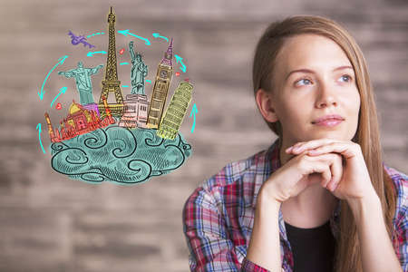 woman dreams a travel, drawing travel concept on wall