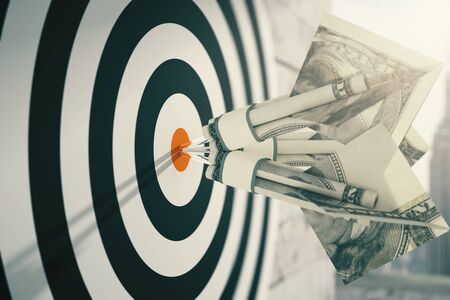 Closeup of dartboard with dollar banknote darts. Concept of targeting. 3D Renderingの写真素材