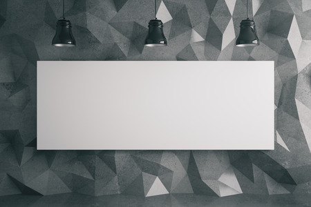 Blank billboard in room with dark polygon patterned wall and ceiling lamps. Mock up, 3D Rendering
