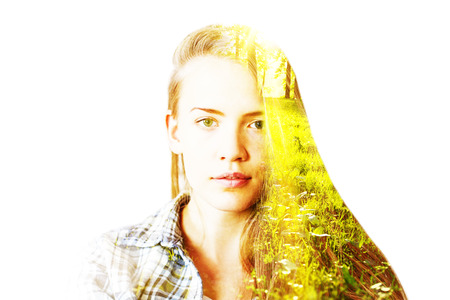 Portrait of attractive young woman on nature background. Double exposureの写真素材