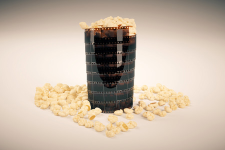 Movie lovers concept with film strip popcorn cup on light background. 3D Renderingの写真素材