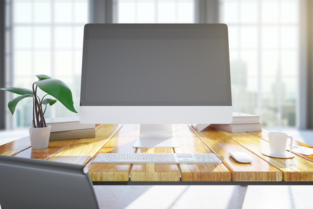 Wooden designer desktop with blank pc monitor, keyboard, plant, coffee cup and other items. Mock up, 3D Renderingの写真素材