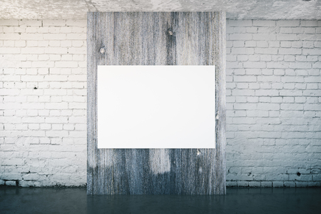 White brick interior with blank poster on dark wooden panel. Mock up, 3D Renderingの写真素材