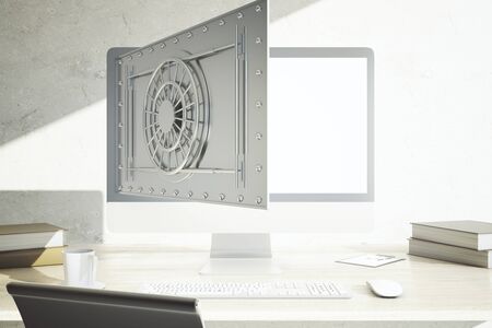 Modern workplace with coffee cup, other items and abstract open bank vault on computer display....
