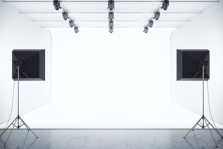 Photo studio with empty white background and professional lighting equipment. Mock up, 3D Renderingの写真素材