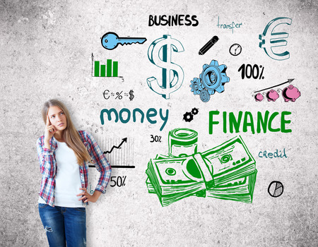 Pensive young woman with creative financial sketch. Research conceptの写真素材