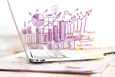 Side view of laptop with creative financial sketchの写真素材