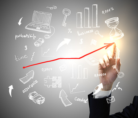 Man's hand drawing creative business sketch with upward arrow on grey background. Success conceptの写真素材