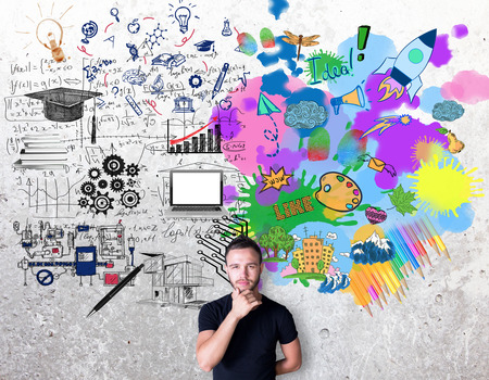 Creative and analytical thinking concept. Thoughtful man with colorful sketch on concrete backgroundの写真素材