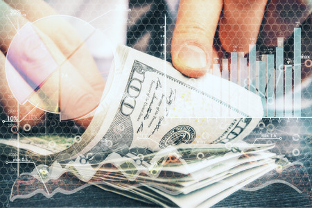 Abstract image of hands counting dollar banknotes on forex background. Double exposure. Financial...
