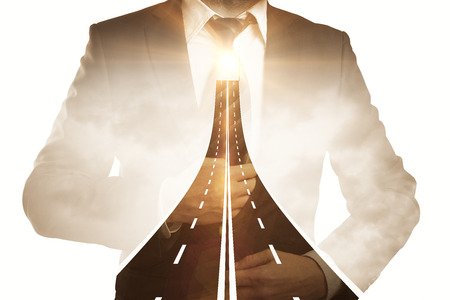 Thoughtful young man in front open door with opportunities. Success concept. Double exposureの写真素材