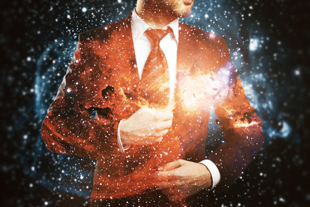 Confident man in suit on abstract space background. Double exposure.の写真素材