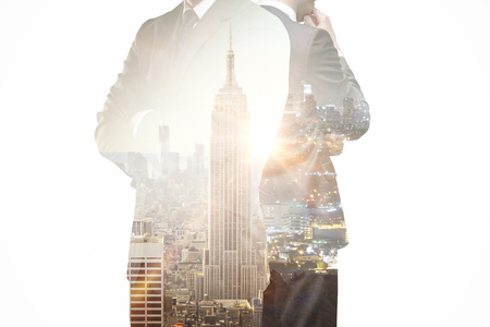 Thoughtful businesspeople on New York city background. Research concept. Double exposureの写真素材
