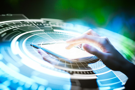 Hand using tablet with abstract digital circle. Technology concept