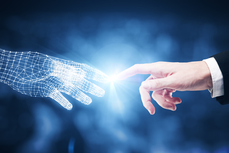 Touching fingers of real and digital businessmen on blurry blue city background. Close up. Future conceptの写真素材