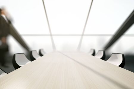 Close up of light wooden conferece table in interior with blurry city view. Mock up, 3D Renderingの写真素材