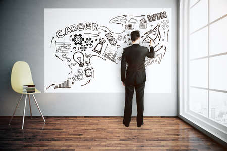 Back view of young businessman in new interior with chair and city view drawing financial sketch on poster. Finance concept. 3D Renderingの写真素材