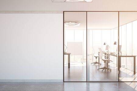 Contemporary simple office interior with glass doors, blank wall with copy space, city view and daylight. Toned image. Mock up, 3D Renderingの写真素材