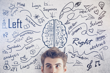 Attractive young man on concrete background with creative sketch. Different brain sides concept